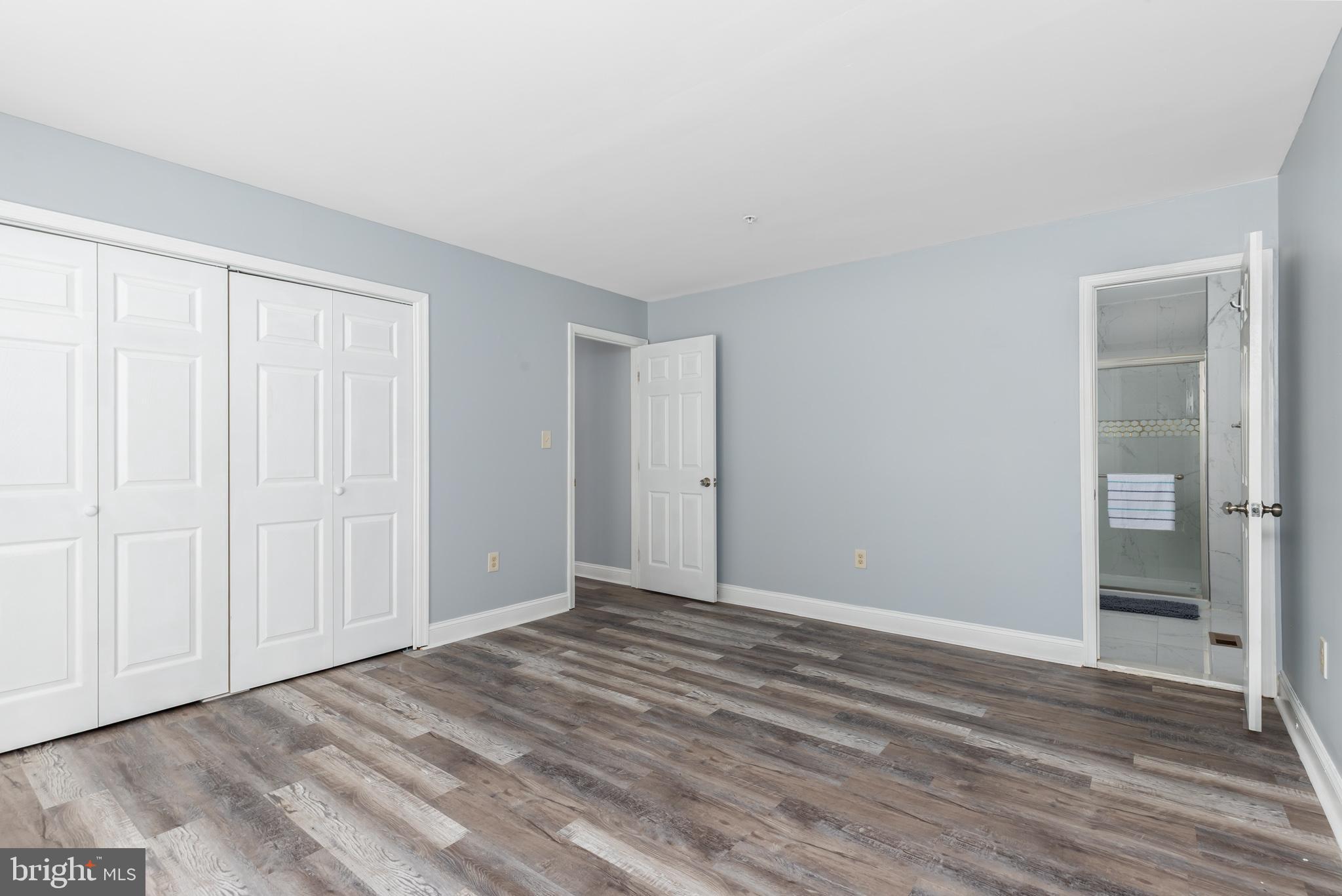 11602 Masters Lane, Unit 120 Berlin, MD 21811 - Photo 11 of 29 a view of an empty room with wooden floor