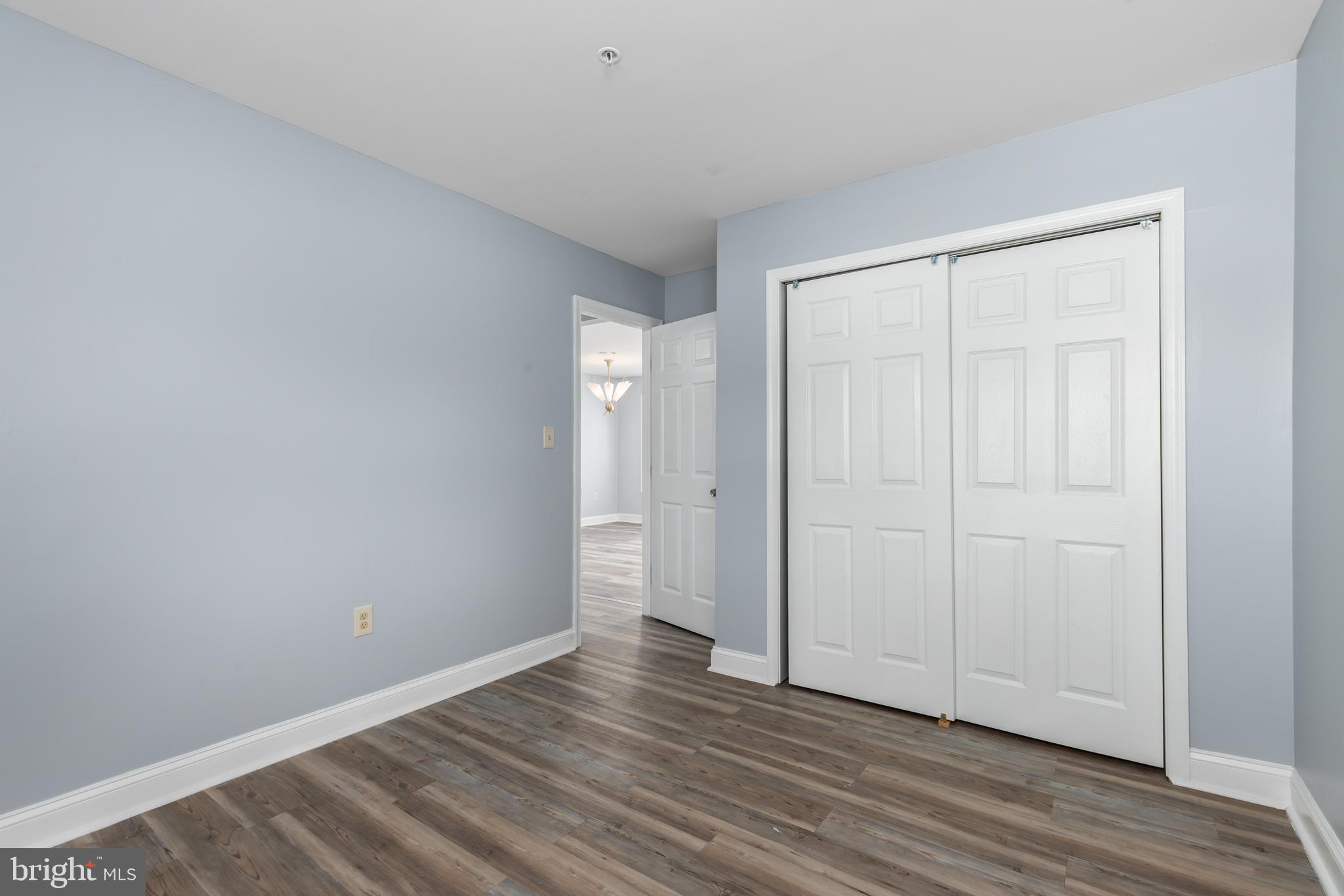 11602 Masters Lane, Unit 120 Berlin, MD 21811 - Photo 14 of 29 a view of an empty room and wooden floor