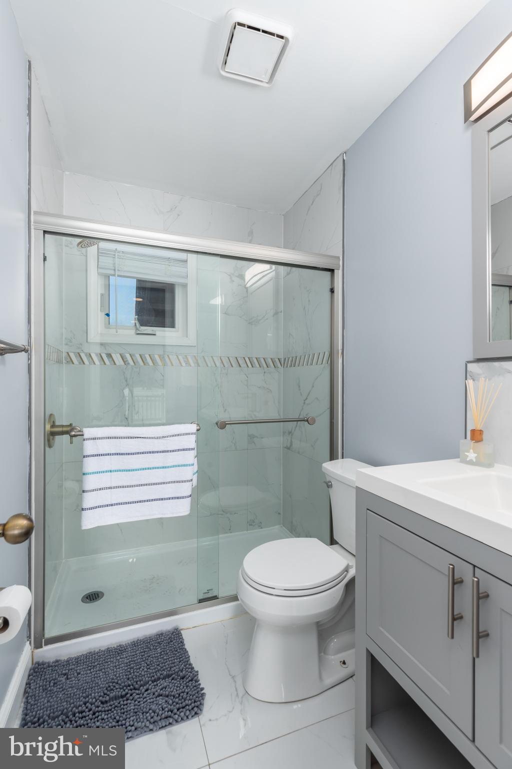 11602 Masters Lane, Unit 120 Berlin, MD 21811 - Photo 15 of 29 a bathroom with a toilet a sink and a shower