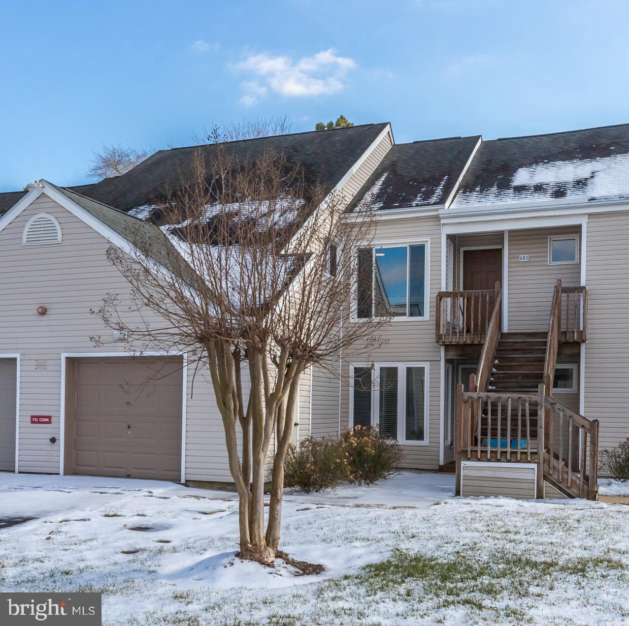 11602 Masters Lane, Unit 120 Berlin, MD 21811 - Photo 23 of 29 a front view of a house with a yard
