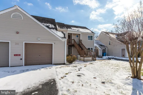 a view of a house with snow on the roof