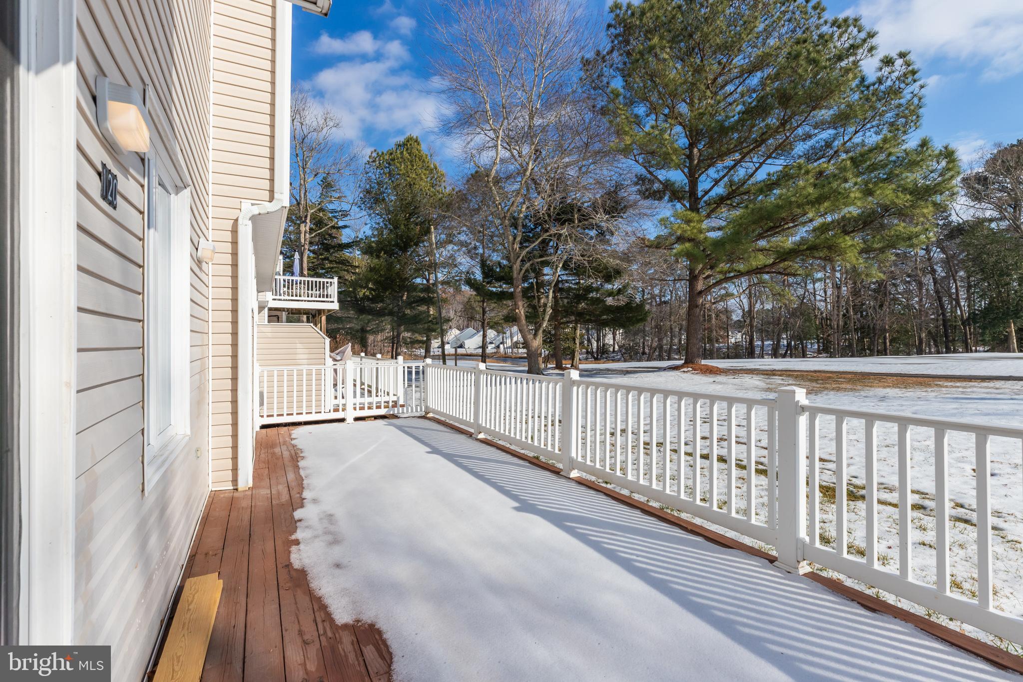 11602 Masters Lane, Unit 120 Berlin, MD 21811 - Photo 25 of 29 a view of a balcony with wooden floor