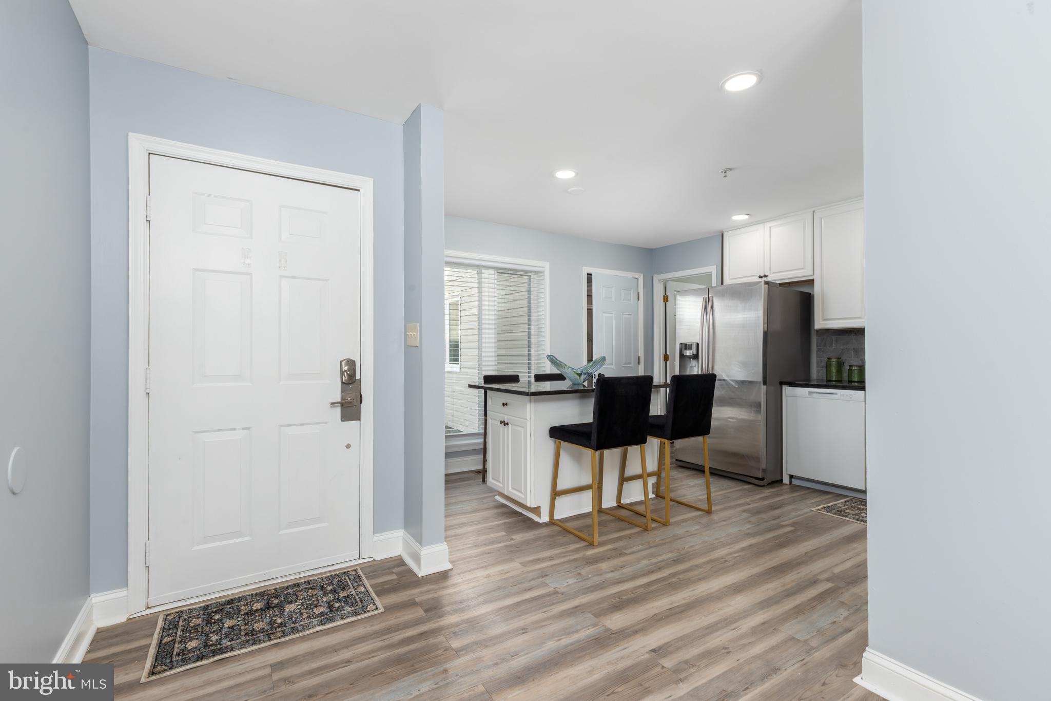 11602 Masters Lane, Unit 120 Berlin, MD 21811 - Photo 3 of 29 a view of kitchen with stainless steel appliances refrigerator sink and stove
