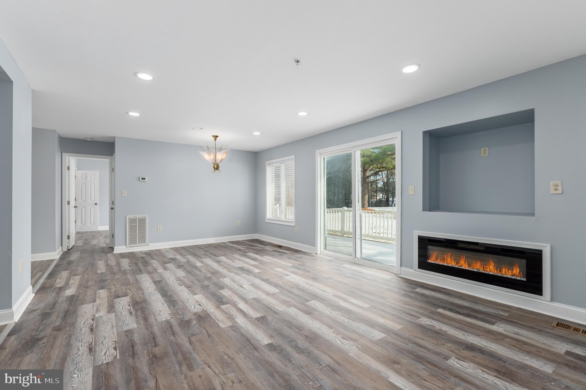 11602 Masters Lane, Unit 120 Berlin, MD 21811 - Photo 8 of 29 a view of empty room with a fireplace