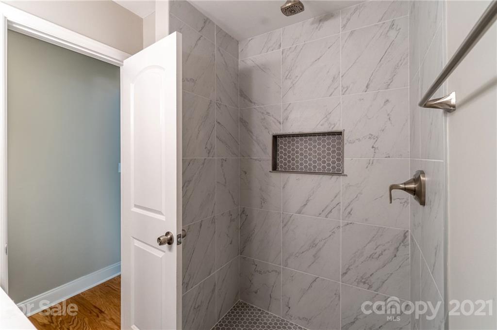 721 Rome Court Charlotte, NC 28209 - Photo 11 of 21 a bathroom with a shower
