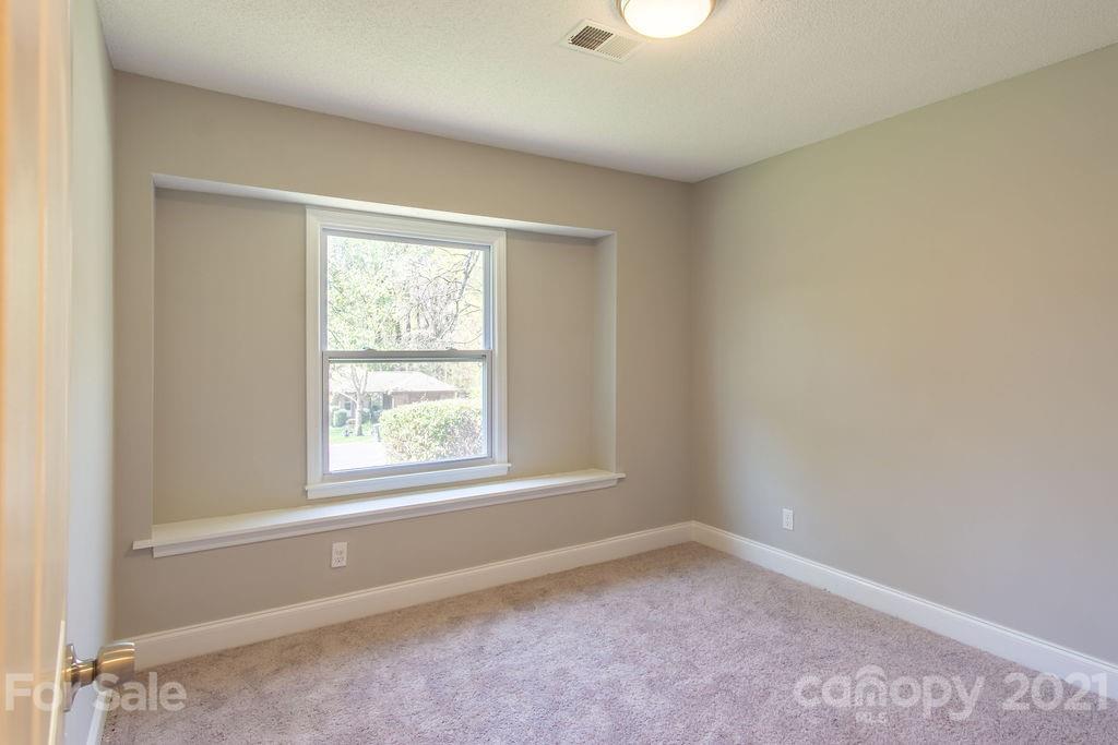 721 Rome Court Charlotte, NC 28209 - Photo 13 of 21 an empty room with a window