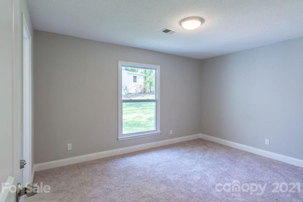 721 Rome Court Charlotte, NC 28209 - Photo 14 of 21 an empty room with a window