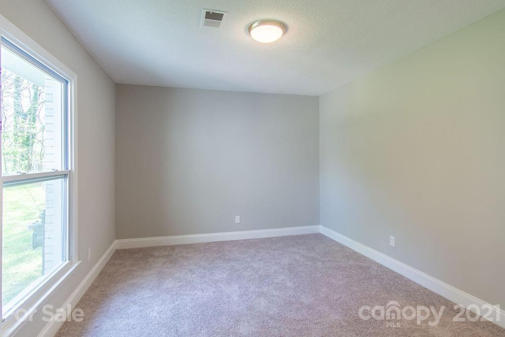 721 Rome Court Charlotte, NC 28209 - Photo 18 of 21 an empty room with a window