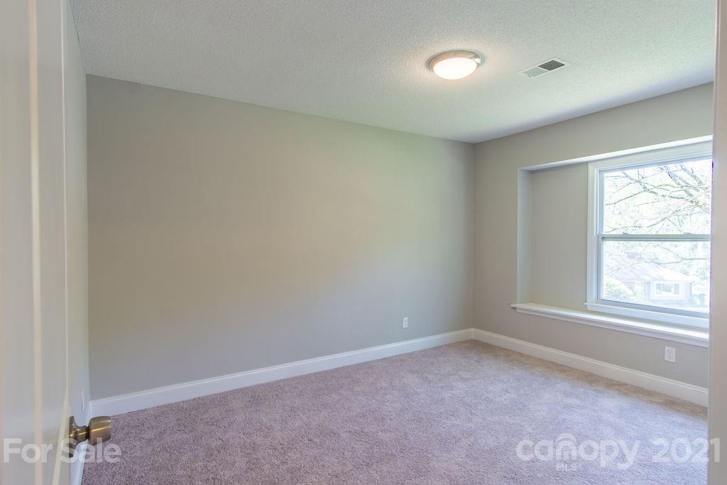 721 Rome Court Charlotte, NC 28209 - Photo 19 of 21 an empty room with a window
