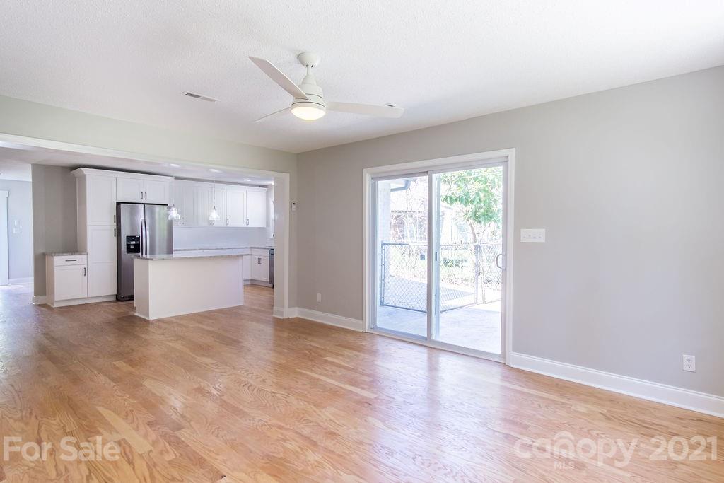 721 Rome Court Charlotte, NC 28209 - Photo 8 of 21 wooden floor in an empty room with a window