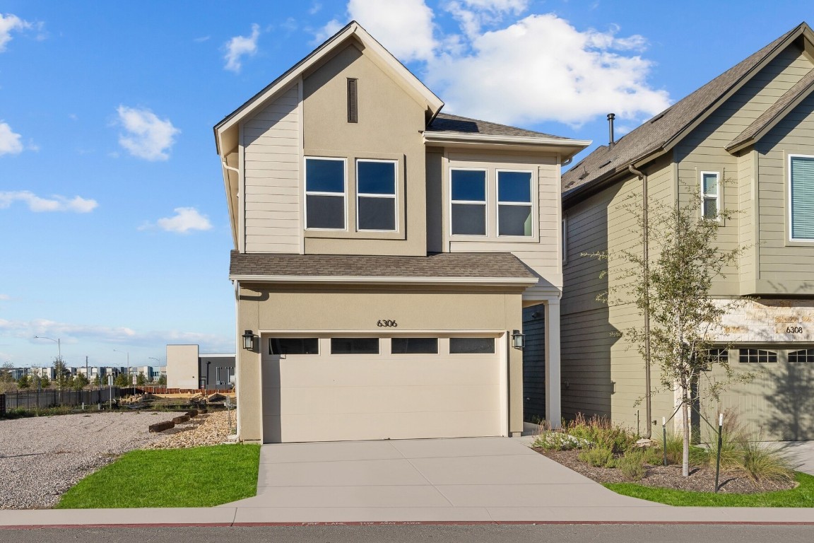 6306 Lautner Lane Austin, TX 78747 - Photo 1 of 1 a front view of a house with a yard and garage