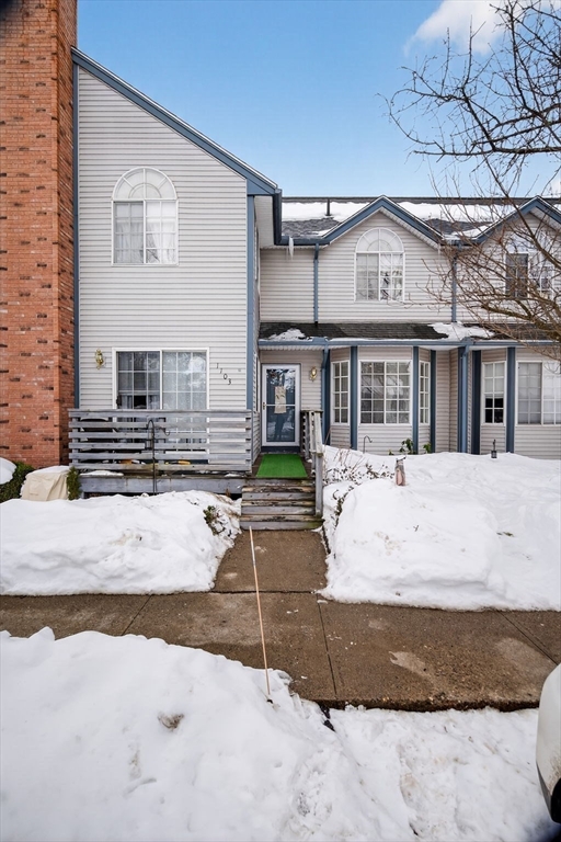 104 Johnson Road, Unit 1103 Chicopee, MA 01022 - Photo 1 of 42 a front view of a house with a yard