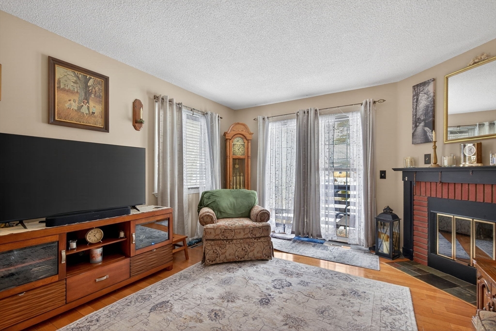 104 Johnson Road, Unit 1103 Chicopee, MA 01022 - Photo 12 of 42 a living room with furniture and a flat screen tv