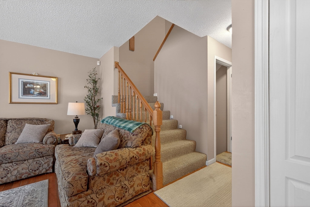 104 Johnson Road, Unit 1103 Chicopee, MA 01022 - Photo 15 of 42 a living room with furniture and a painting
