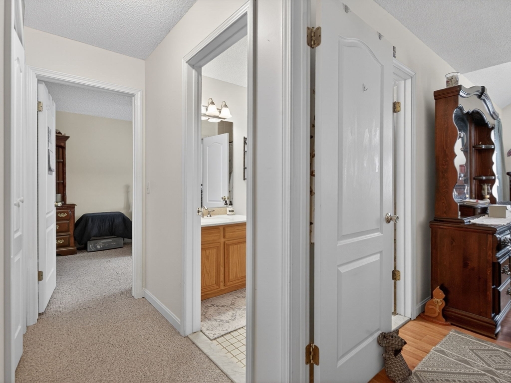 104 Johnson Road, Unit 1103 Chicopee, MA 01022 - Photo 16 of 42 a view of a bedroom from a hallway