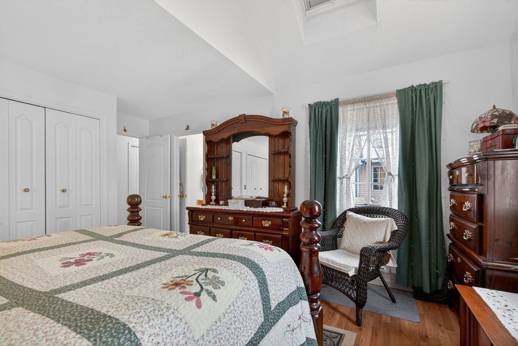 104 Johnson Road, Unit 1103 Chicopee, MA 01022 - Photo 18 of 42 a bedroom with a bed a large window and walk in closet