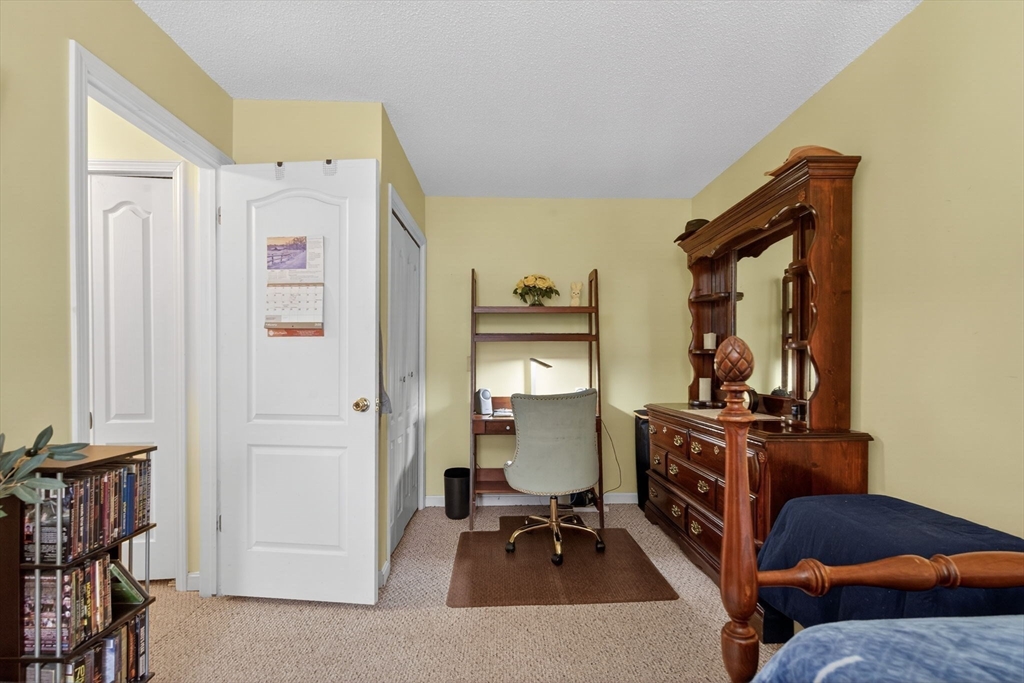 104 Johnson Road, Unit 1103 Chicopee, MA 01022 - Photo 24 of 42 a living room with furniture a rug and a window