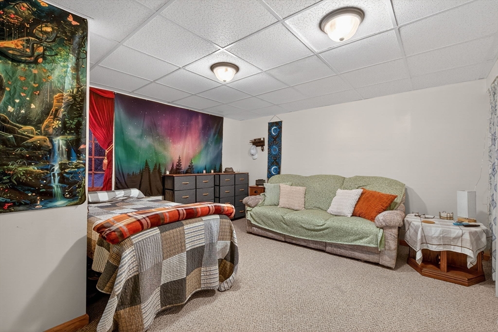 104 Johnson Road, Unit 1103 Chicopee, MA 01022 - Photo 26 of 42 a bedroom with furniture and a ceiling fan