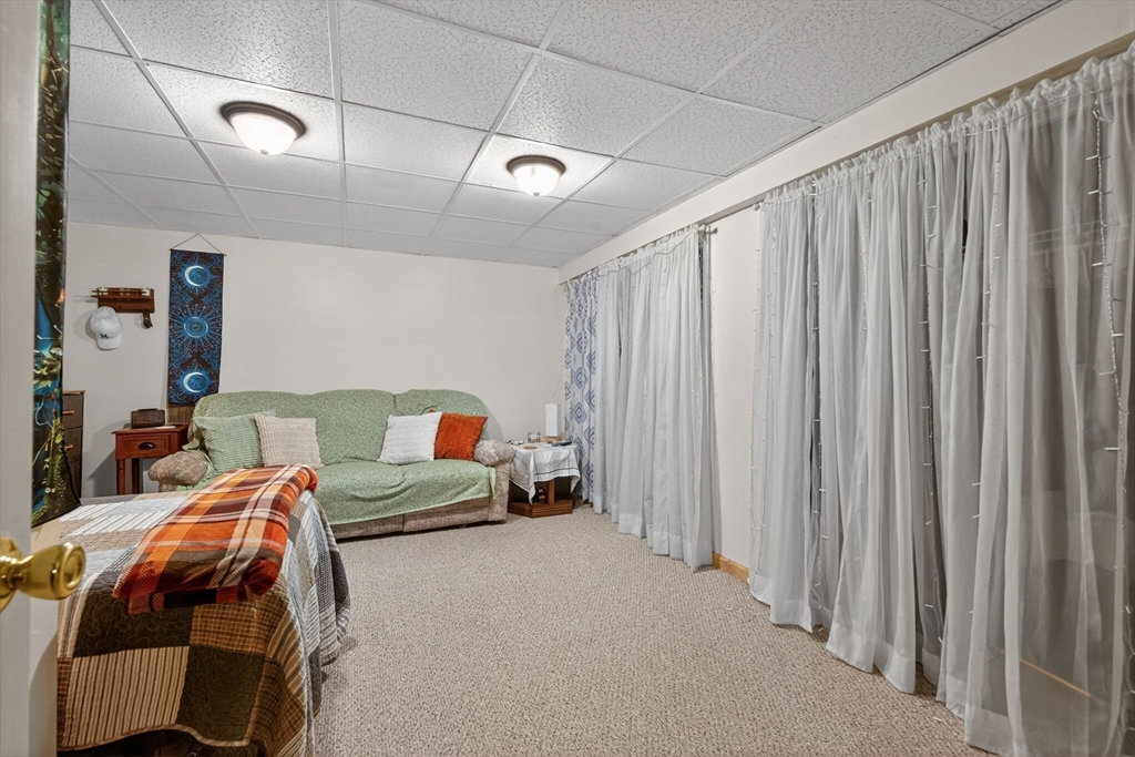 104 Johnson Road, Unit 1103 Chicopee, MA 01022 - Photo 27 of 42 a bed room with a bed and a chair