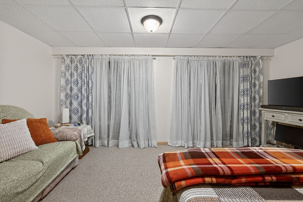 104 Johnson Road, Unit 1103 Chicopee, MA 01022 - Photo 28 of 42 a room with a bed and a couch