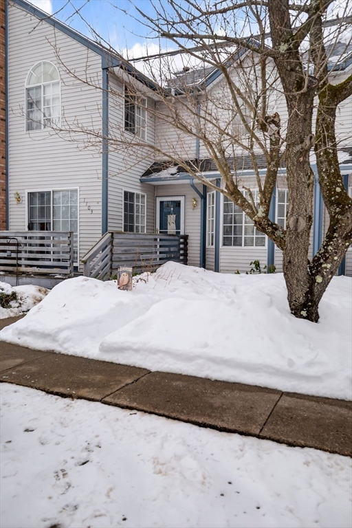 104 Johnson Road, Unit 1103 Chicopee, MA 01022 - Photo 38 of 42 a large white building with a snow in the yard