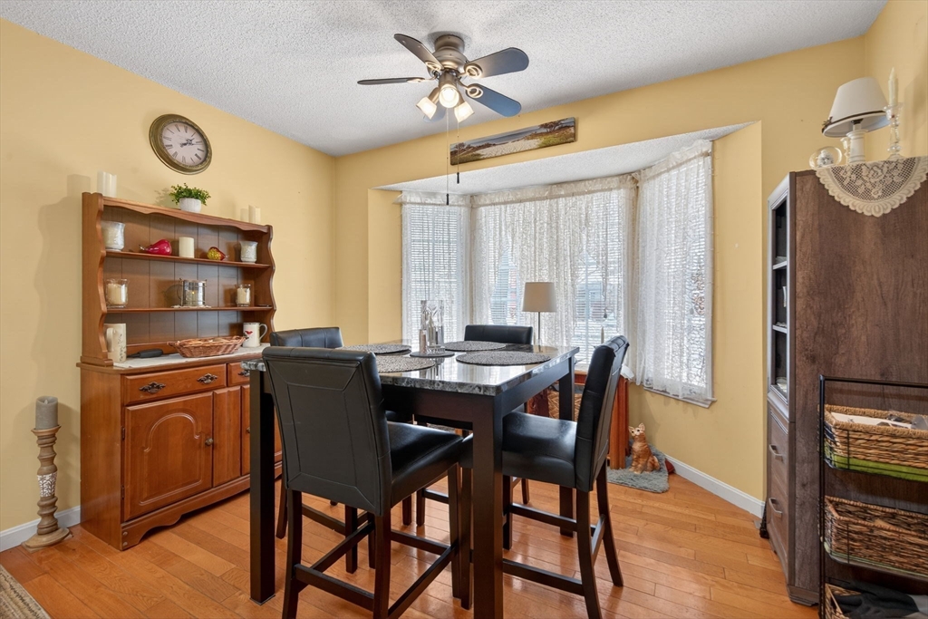 104 Johnson Road, Unit 1103 Chicopee, MA 01022 - Photo 5 of 42 a view of a dining room with furniture window and wooden floor