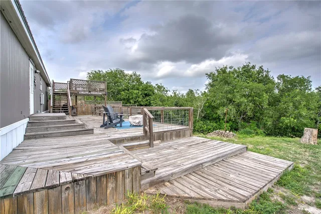 a view of a backyard with sitting area