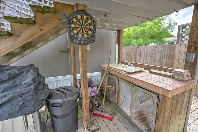 a view of a deck with wooden floor and outdoor space