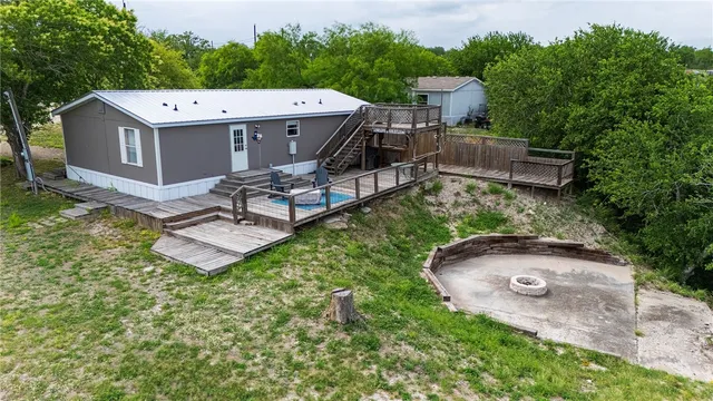 a view of a lush green forest with lots of trees