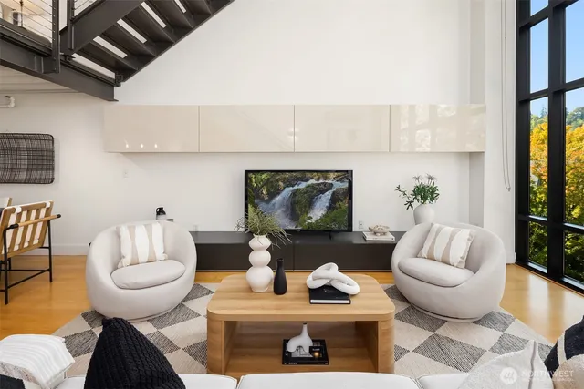 a living room with furniture and a painting