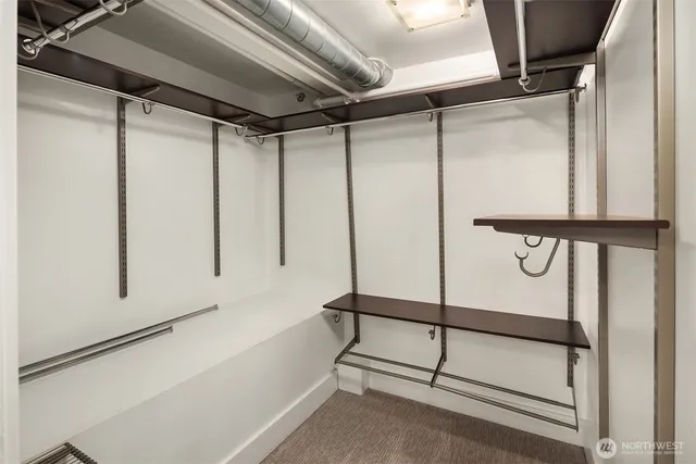 a bathroom with a shower and a mirror