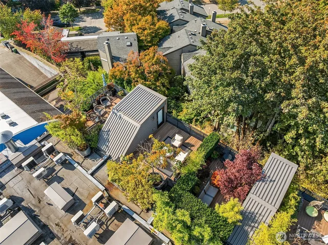 an aerial view of a house with a yard and garden