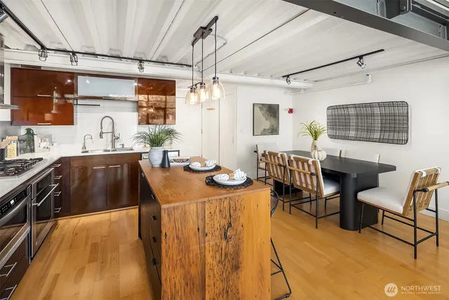 a kitchen with sink and refrigerator
