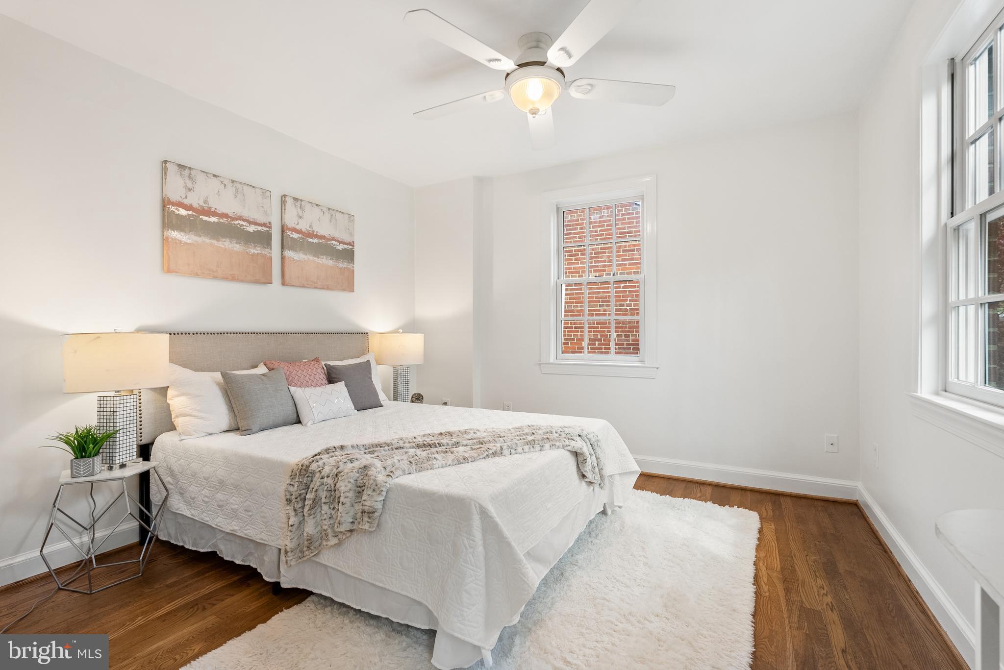 4521 Clark Place Northwest Washington, DC 20007 - Photo 14 of 27 a bedroom with a large bed and a window