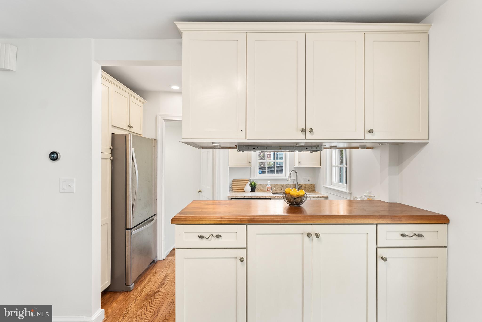 4521 Clark Place Northwest Washington, DC 20007 - Photo 7 of 27 a kitchen with stainless steel appliances a refrigerator sink and cabinets