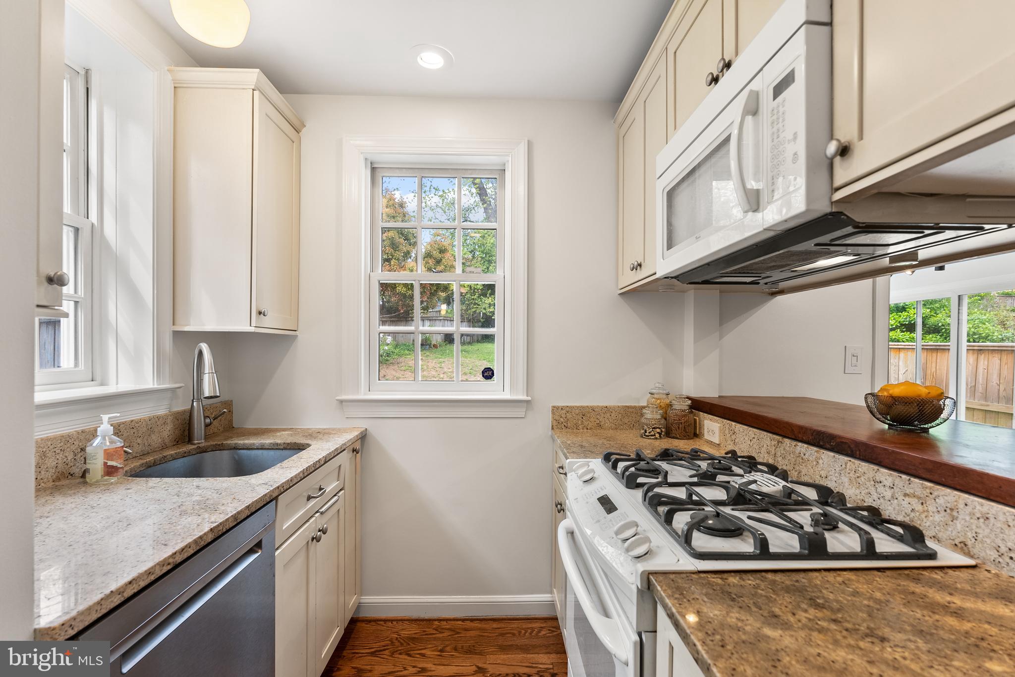 4521 Clark Place Northwest Washington, DC 20007 - Photo 8 of 27 a kitchen with stainless steel appliances granite countertop a stove and a sink