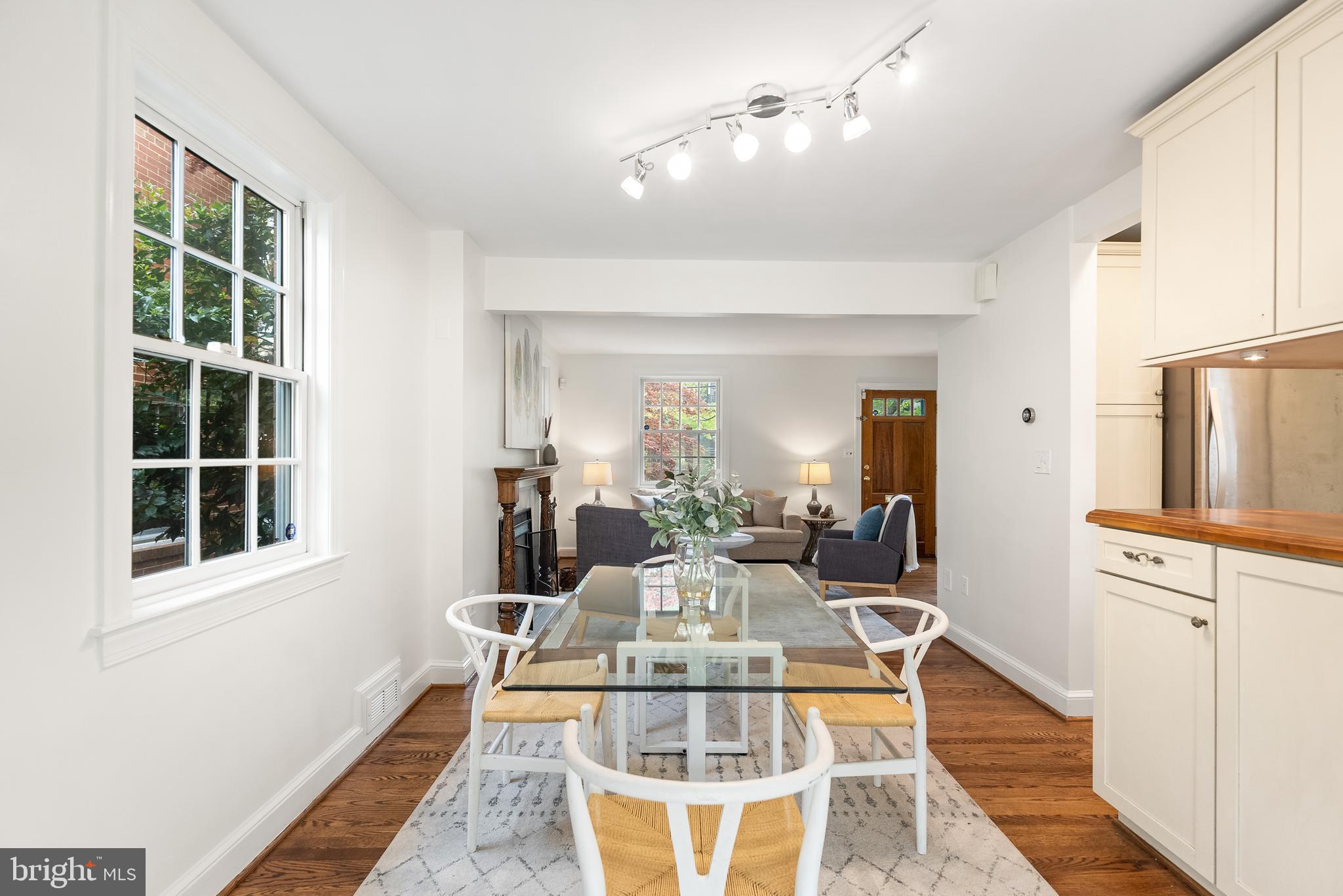 4521 Clark Place Northwest Washington, DC 20007 - Photo 9 of 27 a view of a dining room with furniture window and wooden floor