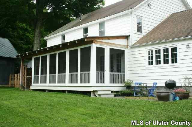 660 Vly Road Stone Ridge, NY 12484 - Photo 2 of 5 a view of a house with a yard