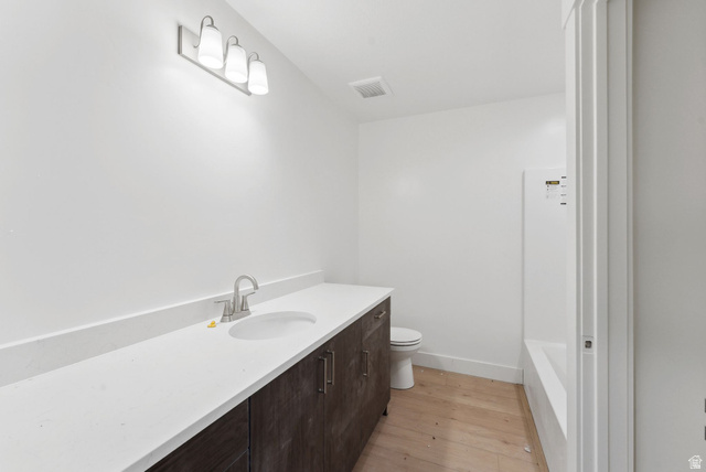1617 North Angel Street Layton, UT 84041 - Photo 25 of 43 Full bathroom featuring vanity and light wood-type flooring