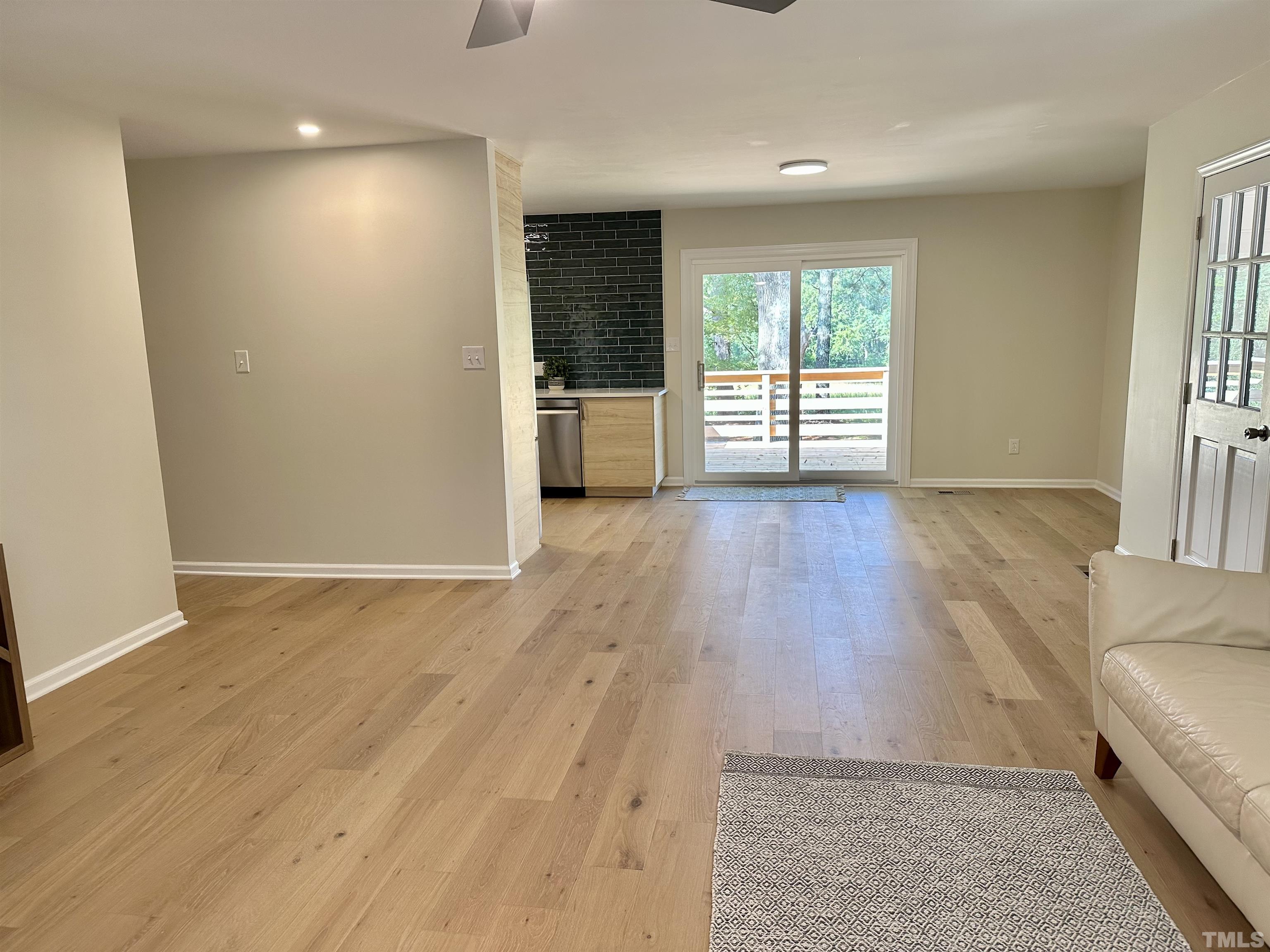 8904 Ransdell Road Raleigh, NC 27603 - Photo 11 of 23 an empty room with wooden floor and windows