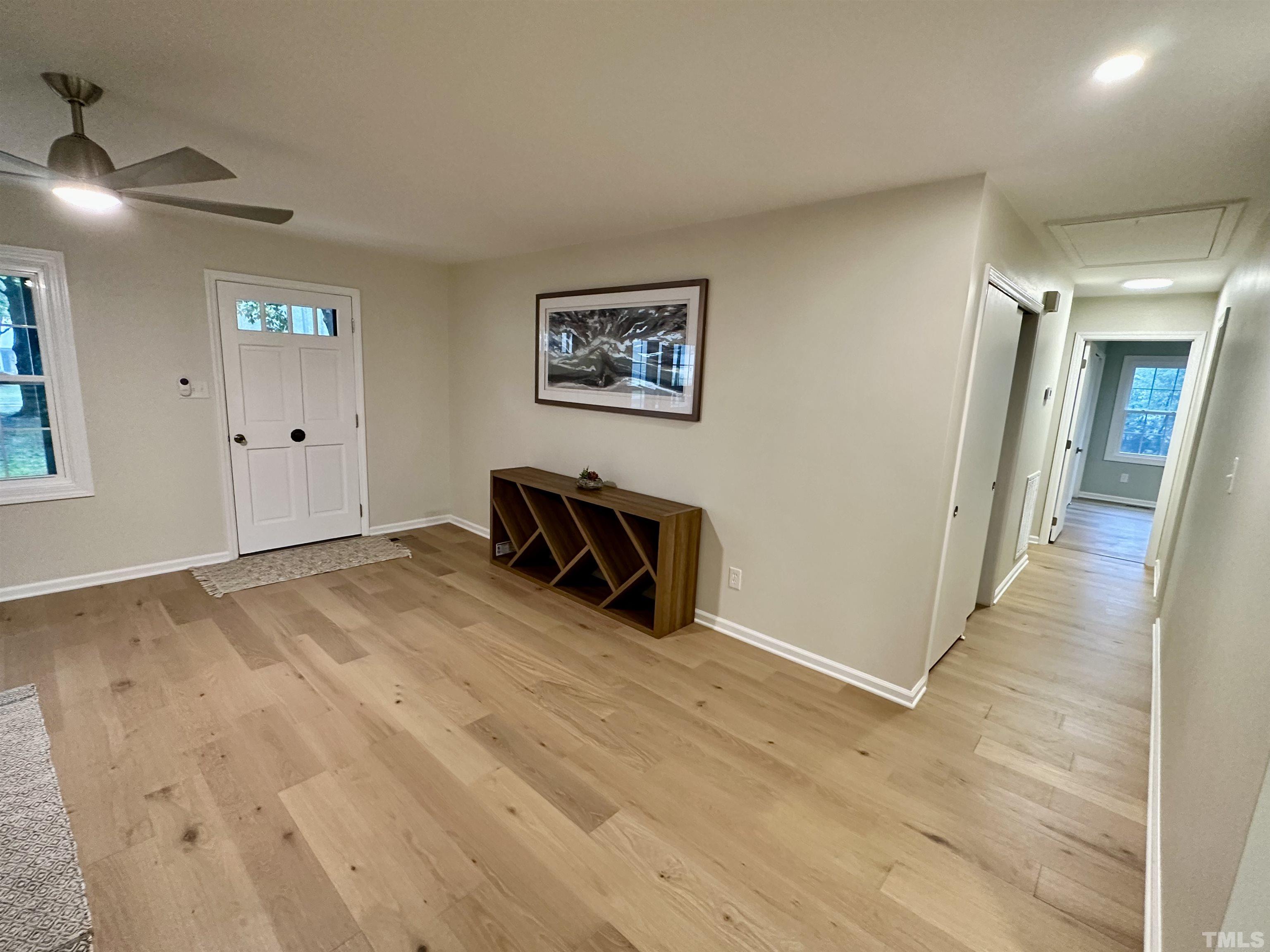 8904 Ransdell Road Raleigh, NC 27603 - Photo 13 of 23 a view of a livingroom with wooden floor