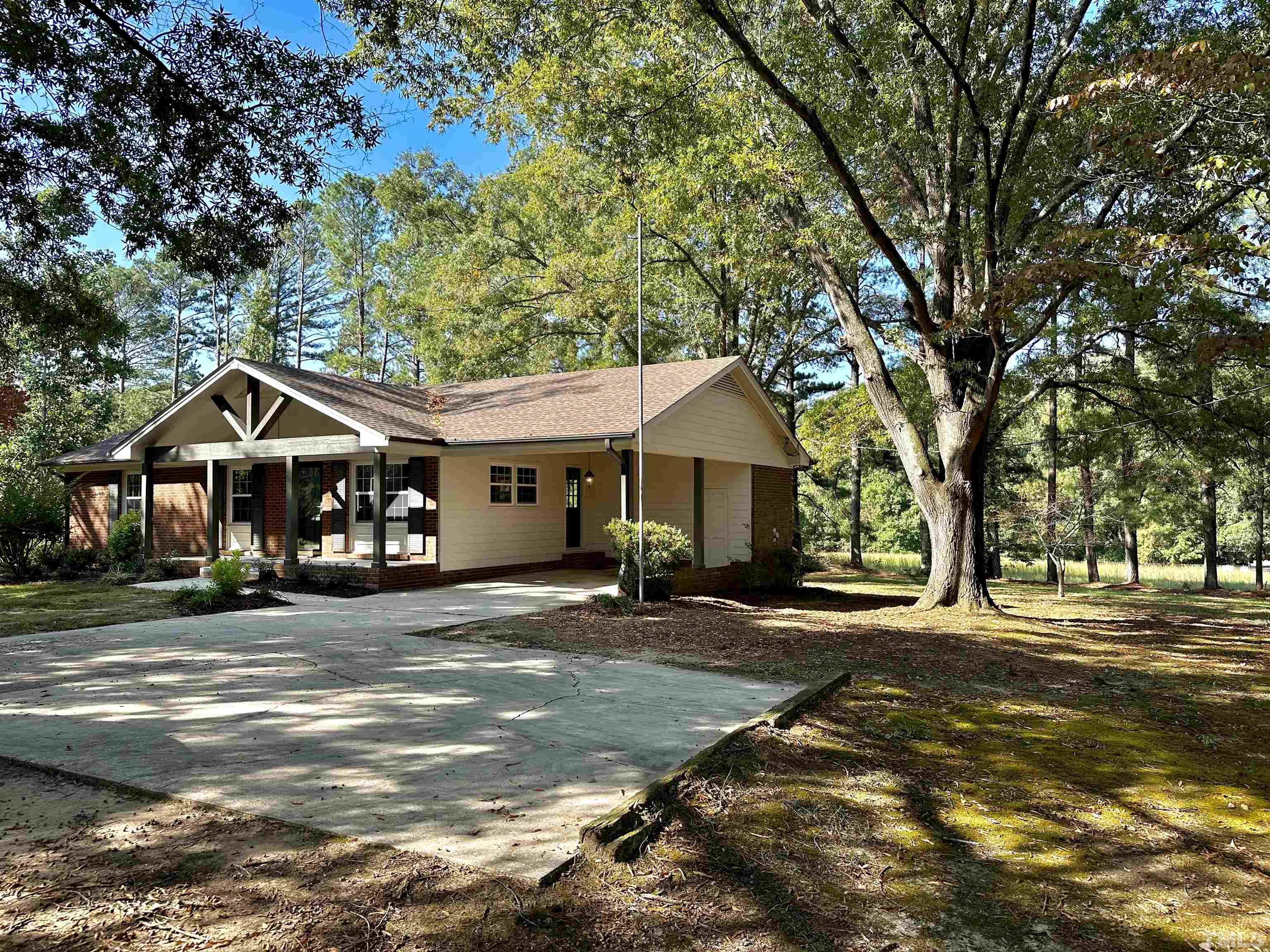 8904 Ransdell Road Raleigh, NC 27603 - Photo 2 of 23 a front view of a house with a yard