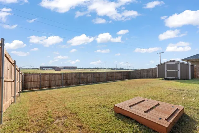 a view of a swimming pool and an outdoor seating