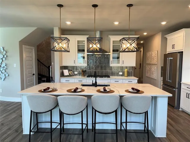 a living room with furniture fireplace and a large window