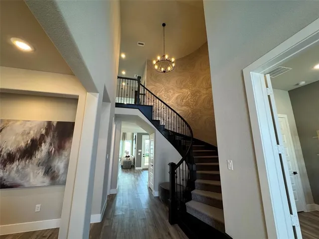 an open kitchen with kitchen island and stainless steel appliances