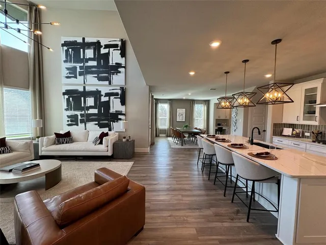 a large kitchen with a table and chairs