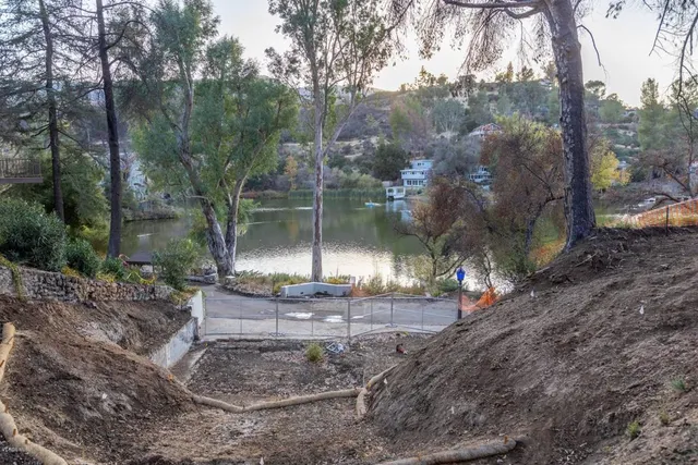 a view of a fountain in middle of the forest