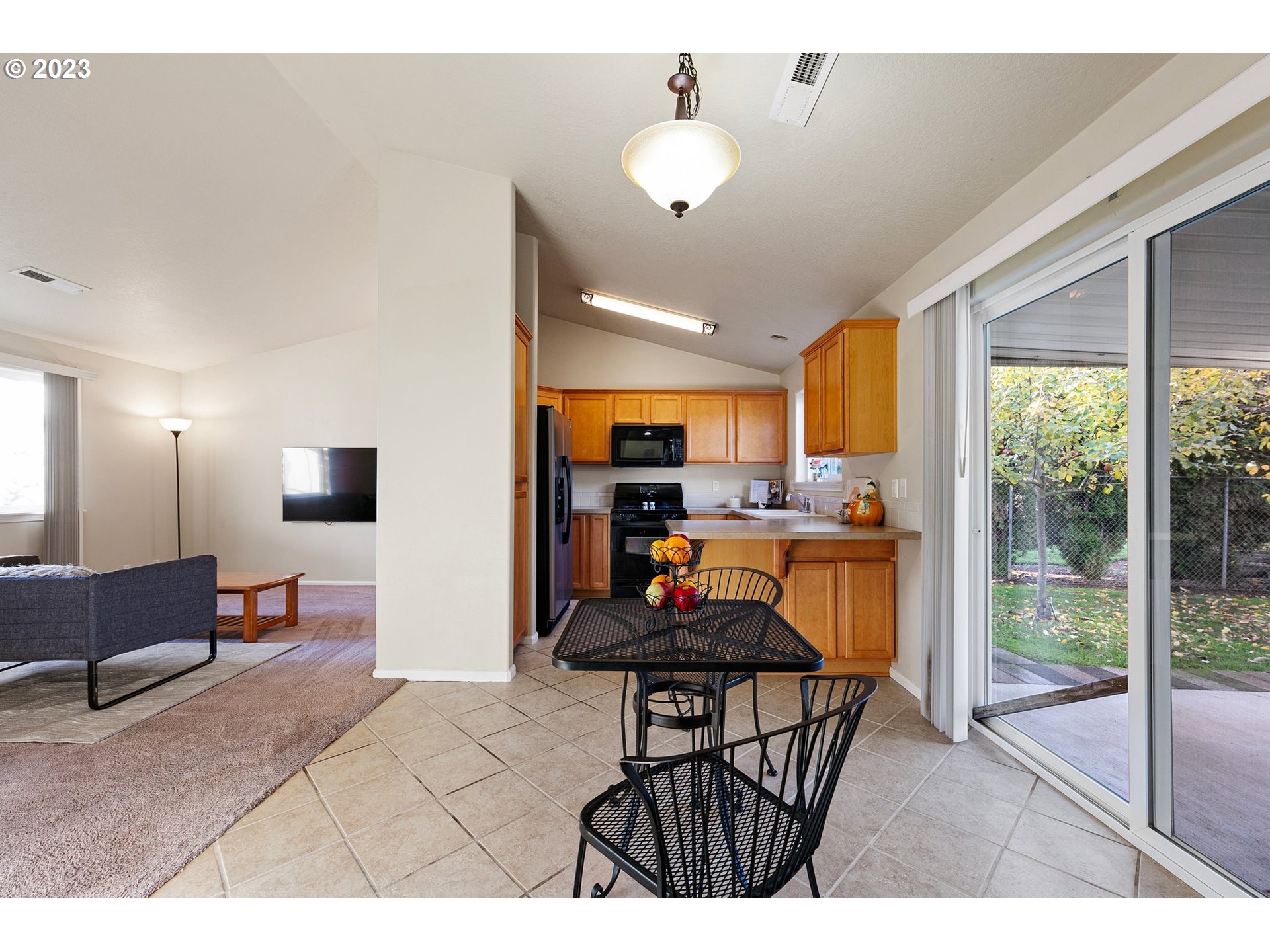 340 54th Street Springfield, OR 97478 - Photo 14 of 40 a living room with furniture and a flat screen tv