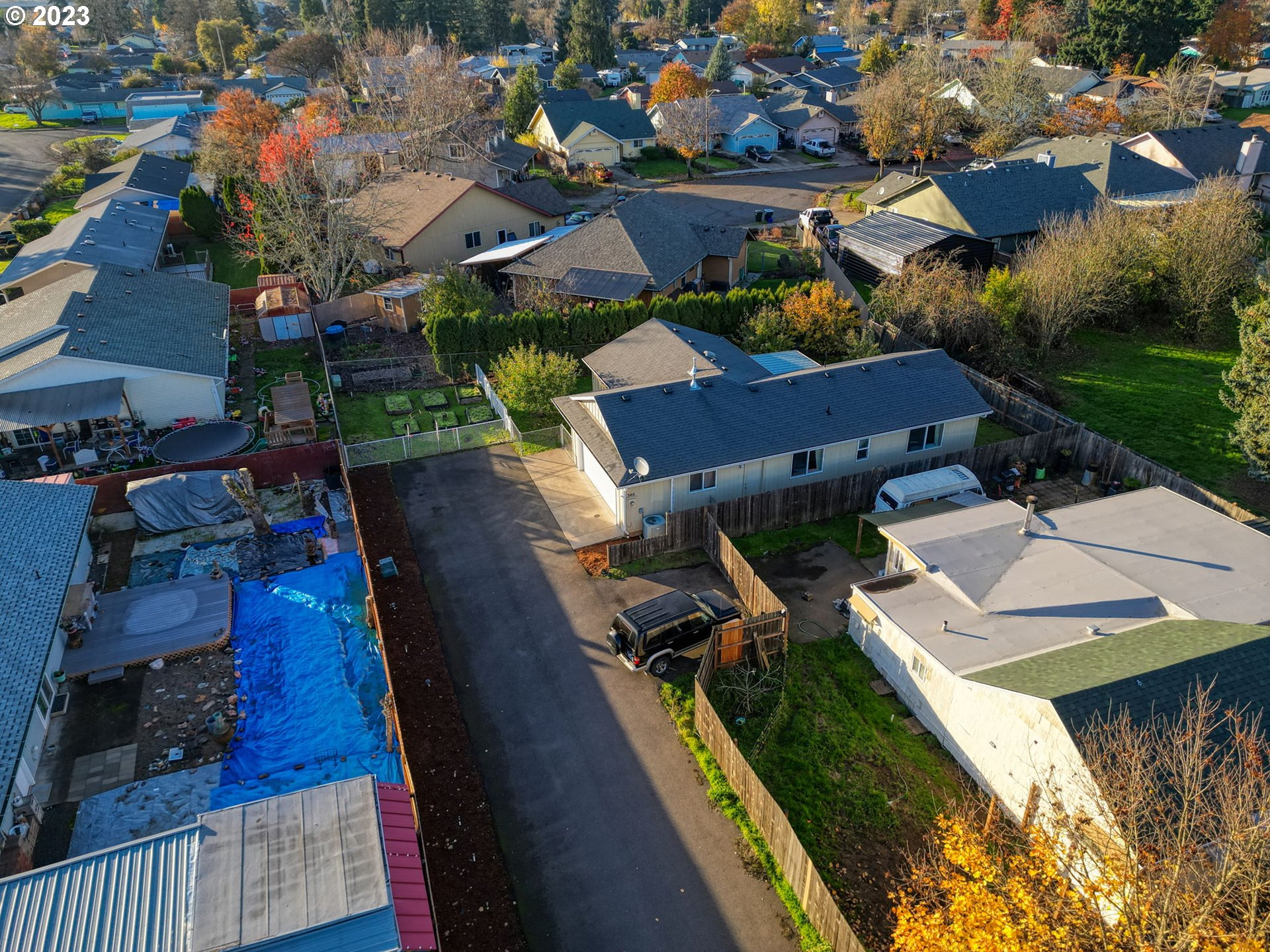 340 54th Street Springfield, OR 97478 - Photo 34 of 40 an aerial view of a house with garden space and street view