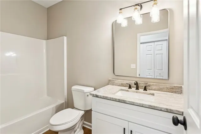 an empty room with a ceiling fan and window